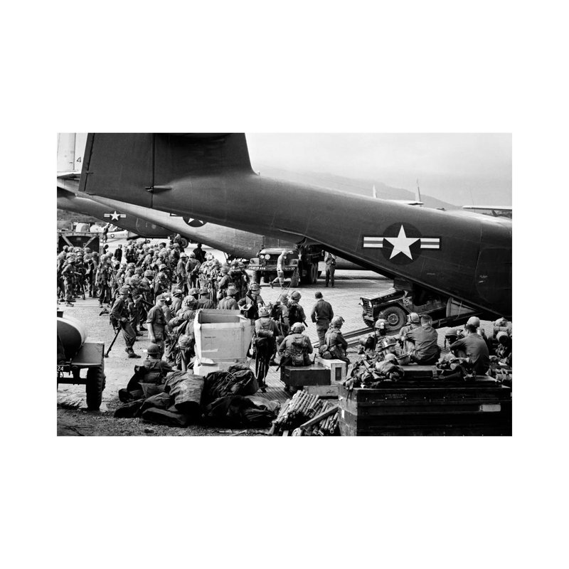 1960s Military Personnel Gathered Under Tails Of Planes In Airfield by Vintage Images - Wrapped Canvas Print