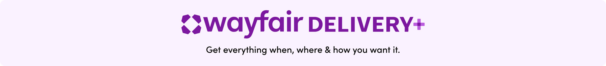 Wayfair Delivery+ promotional image showing two delivery workers carrying a white sofa to a home while a woman greets them at the door, with a Wayfair delivery truck in the background and a 'Now in Select Markets' badge