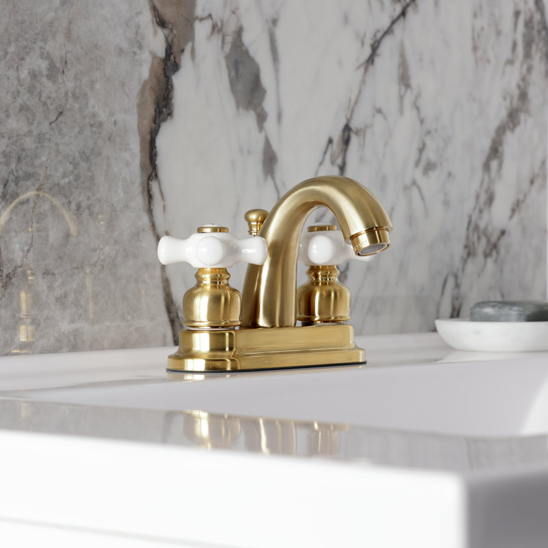 Kingston Brass Restoration Two-Handle 3-Hole Deck Mount 4" Centerset Bathroom Faucet with Plastic Pop-Up, Satin Brass
