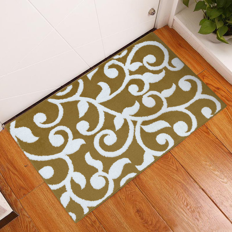 Tapis beige / blanc en polypropylène à motif floral Kaelan