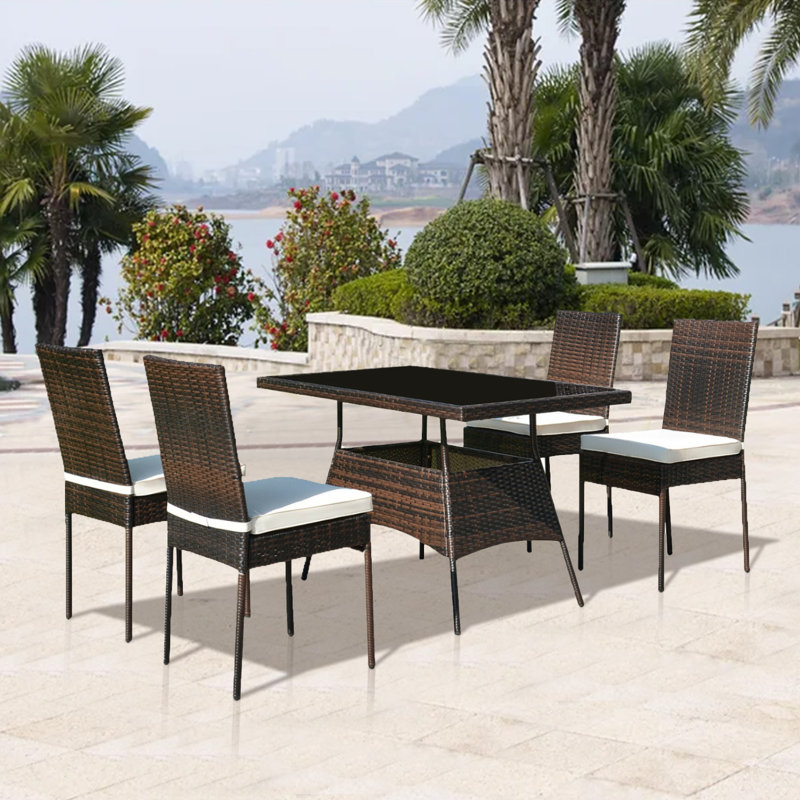 Ladera 4 - Person Wicker Patio Dining Set with Rectangular Table , Cushions Included, Brown