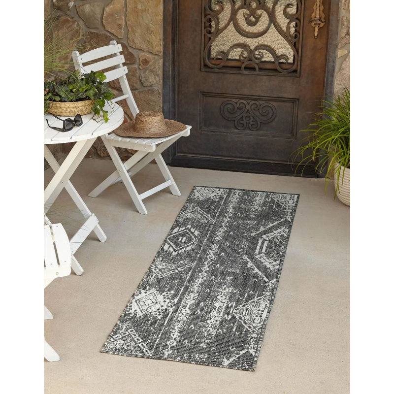 Tapis intérieur / extérieur gris anthracite / blanc en polypropylène tissé à la machine Wilmslow