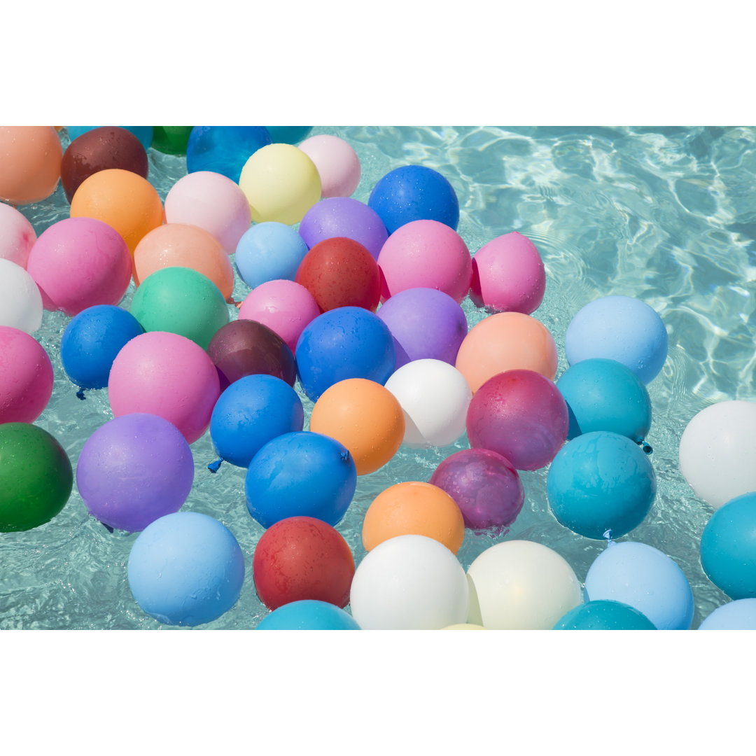 Ballons Floating In A Swimming Pool von Emptyclouds - Leinwand Kunstdrucke