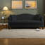 Élégant canapé Chesterfield en velours noir, design classique pour le salon