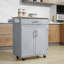 Îlot de cuisine avec chariot, tiroir, armoire de rangement et porte-serviettes