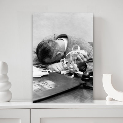 1930s 1940s MAN WITH HEAD DOWN ON DESK AND STOCK TICKER TAPE IN HAND 1 Piece Wrapped Canvas Wall Art