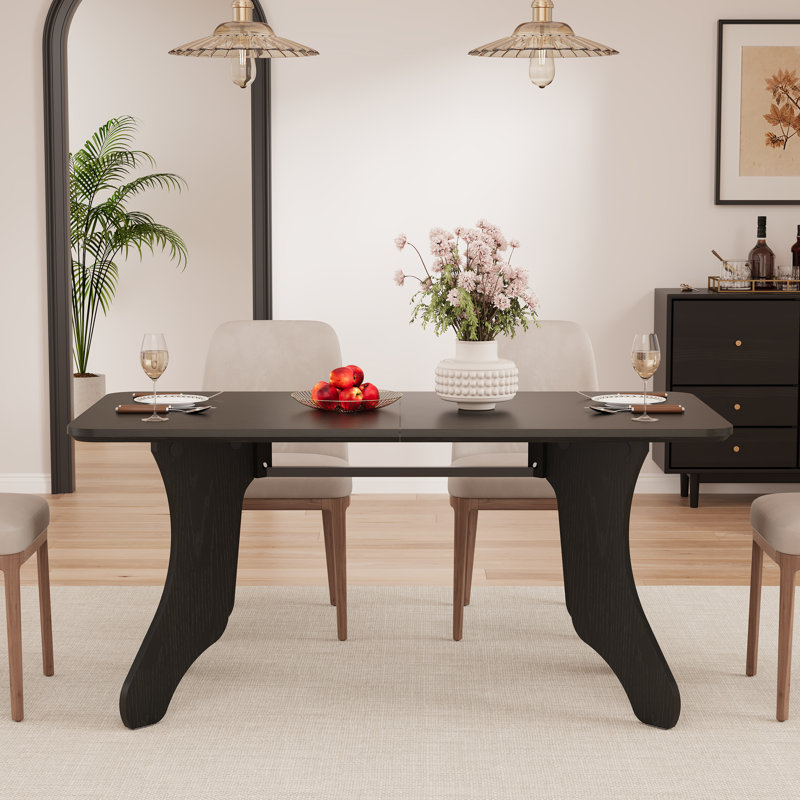 Table à manger rectangulaire de 160 cm pour 4 à 6 personnes, avec pieds inspirés des bois de cerf et structure métallique robuste, style ferme moderne.