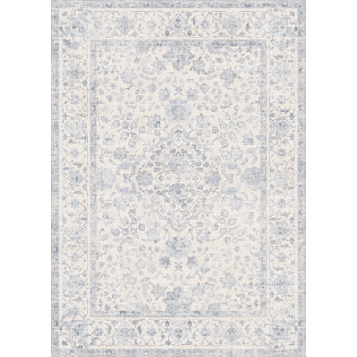 Tapis Elora lavable à la machine à motif floral avec envers antidérapant bleu