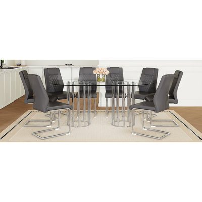 Ensemble de table et de chaises Table de salle à manger ovale en verre trempé de 71 pouces, double colonne argentée de style luxueux clair, chaises en polyuréthane gris foncé avec pieds en métal arqués argentés, table moderne et ensemble de meubles 8 places.