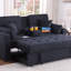 Causeuse convertible en tissu tissé gris foncé de 70 po de largeur avec console rabattable, porte-gobelets, ports de chargement, poche et siège à ressorts ensachés