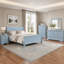 Lit traîneau Louis Philippe en bois massif pour enfant, alliant design élégant et construction durable pour un confort durable.