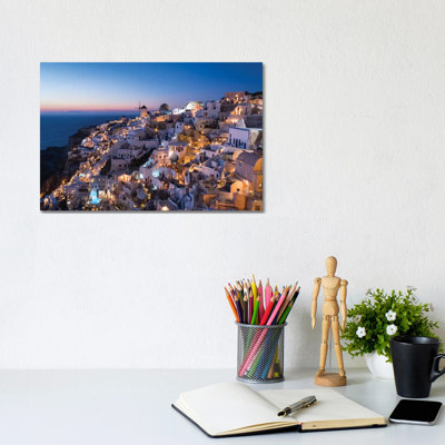 Greece, Santorini. the Village of Oia Glows in the Post-Sunset Light as the Town'S Lights Add Magic to This Iconic Scene. by Brenda Tharp - Wrapped Canvas Graphic Art