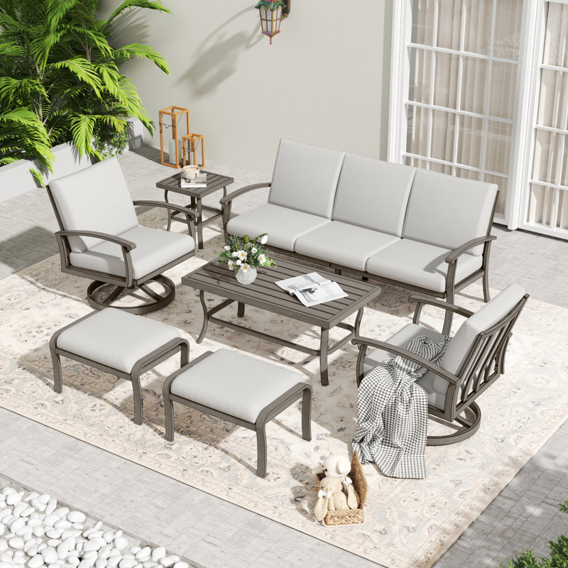 7-Piece Aluminum Patio Conversation Set With Coffee Table, End Table, Ottomans And Light Gray Cushions