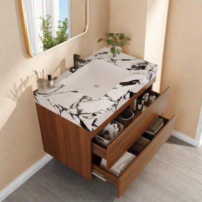 Meuble-lavabo moderne peu encombrant avec comptoir en faux marbre et lavabo en céramique, idéal pour les petites salles de bain