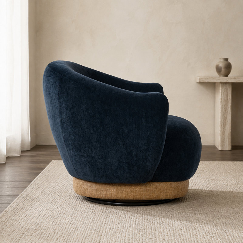 Fauteuil d'appoint pivotant moderne avec accoudoirs enveloppants évasés, siège rembourré profond et base ronde superposée