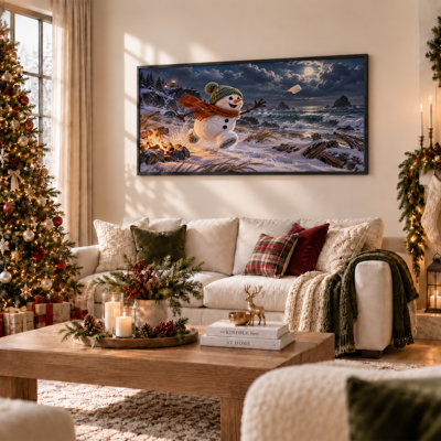 Impression sur toile, bonhomme de neige jetant une guimauve sur une plage enneigée à Noël