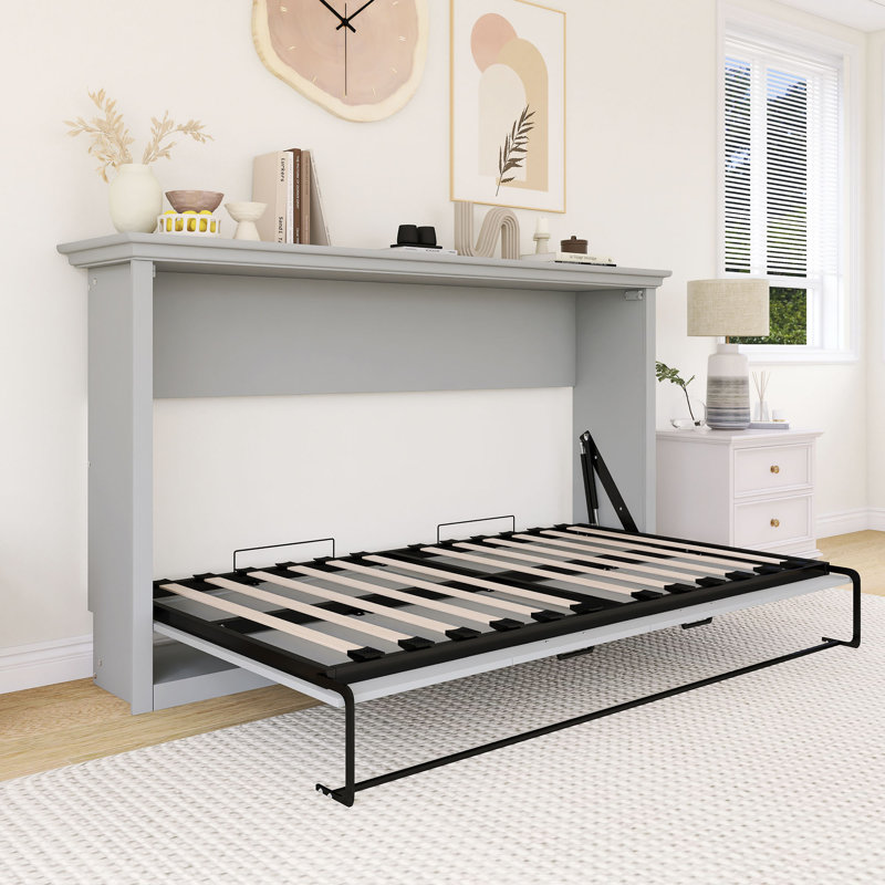 Lit escamotable gris de taille simple, peut être plié dans une armoire