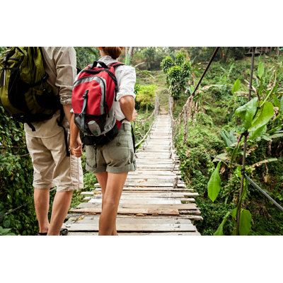 Couple with Backpack Hiking by Fredfroese