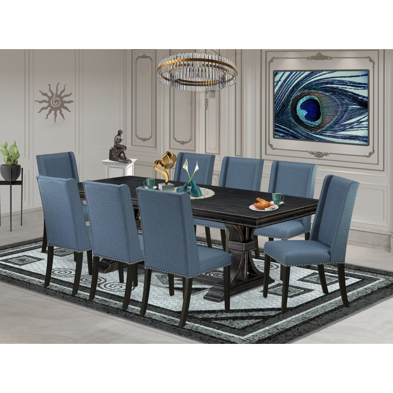L'ensemble de table à manger 9 pièces se compose d'une table en bois et de 8 chaises rembourrées en tissu de lin bleu minéral avec dossier rembourré - finition noir sablé.