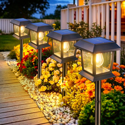 Paquet de 4 lumières de sentier solaires, lumières de paysage extérieures imperméables IP65 avec ampoule Edison à DEL blanc chaud, lumières de marche à énergie solaire marche / arrêt automatiques pour le jardin, la pelouse, l'allée, la décorati