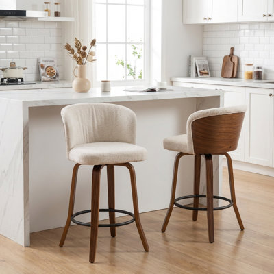 Tabouret de comptoir pivotant rembourré avec structure en bois Devaney