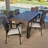 Aaruhi 6 - Person Acacia Wicker Patio Dining Set with Rectangular Table