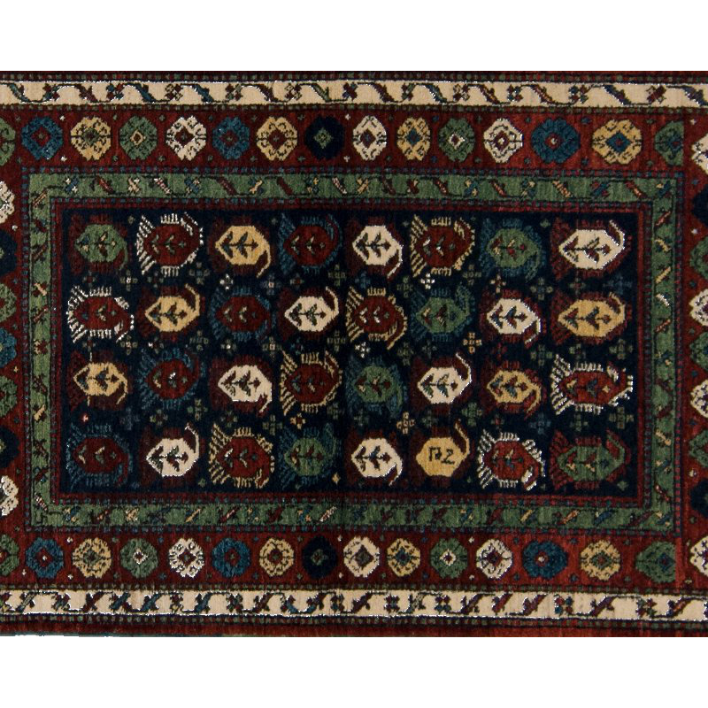 Seychour Wool Oriental Area Rug in Green/Red
