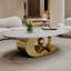Table basse en marbre avec base sculpturale en acier inoxydable seulement la table, sans chaises.-652184828