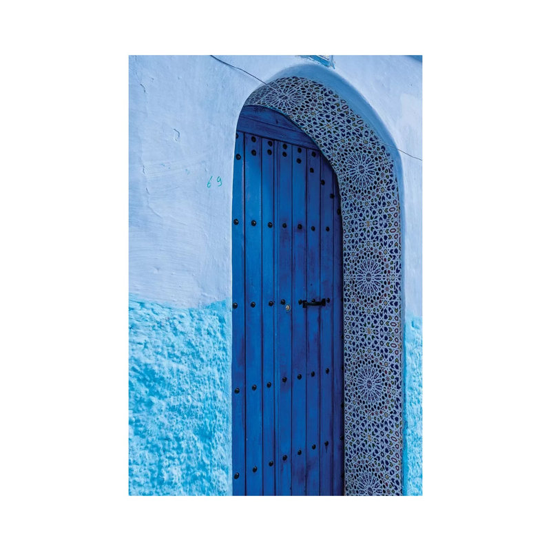 Africa, Morocco, Chefchaouen. Arch Over Wooden Door. by Jaynes Gallery - Wrapped Canvas Print
