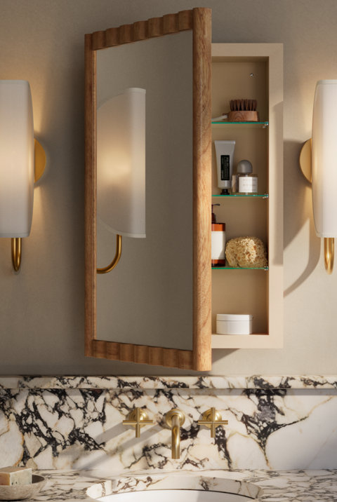 Bathroom with wooden medicine cabinet and marble sink.