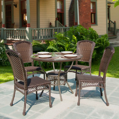 Selbyville 4 - Person Patio Dining Set with Round Table