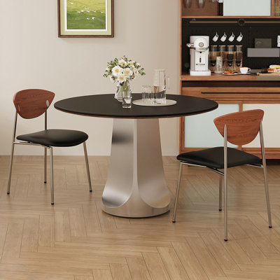 Table de salle à manger ronde en pierre frittée noire et argentée et acier inoxydable