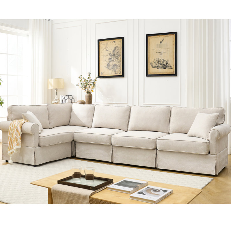 Canapé modulaire en L à 5 places, rembourré beige avec accoudoirs roulés et coussins modulaires mi-moelleux, Beige