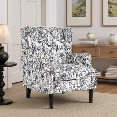 Fauteuil à oreilles en similicuir noir rembourré avec garniture cloutée Duward