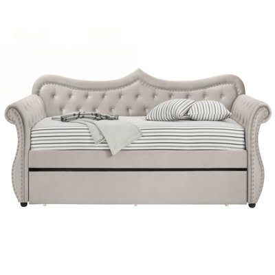 Beige Upholstered Twin Daybed with Trundle, Sturdy Support and Extra Sleeping Space for Modern Living.