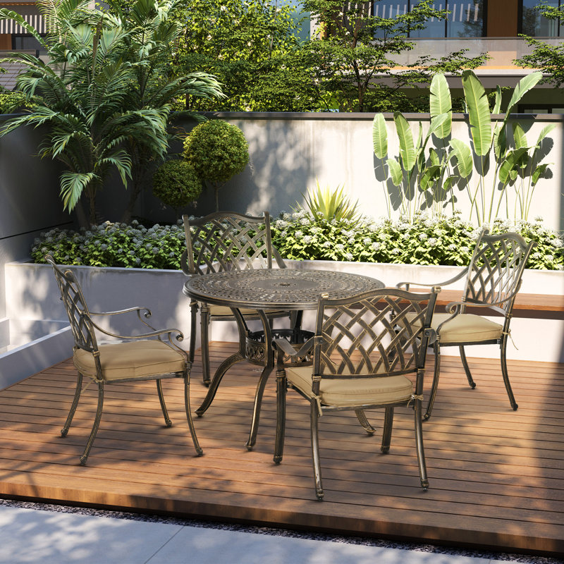 Mixson 4 - Person Patio Dining Set with Round Table