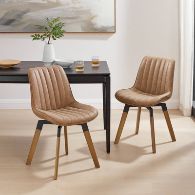 Bishaan Tufted Faux Leather Upholstered Swivel Dining Side Chair