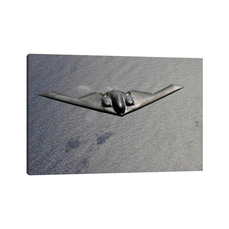 A B-2 Spirit Flies Over The Pacific Ocean - Wrapped Canvas Print, 66.04 cm H x 45.72 cm W x 3.175 cm D