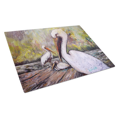 Three Pelicans on a Pier Glass Cutting Board