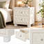 Table de chevet en velours beige avec 2 tiroirs, poignées en cristal, capitonnage à boutons, idéale pour la chambre à coucher.