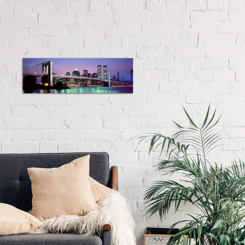 An Illuminated Brooklyn Bridge With Lower Manhattan's Financial District Skyline In The Background, New York City, New York - No Frame Panoramic Print on Canvas