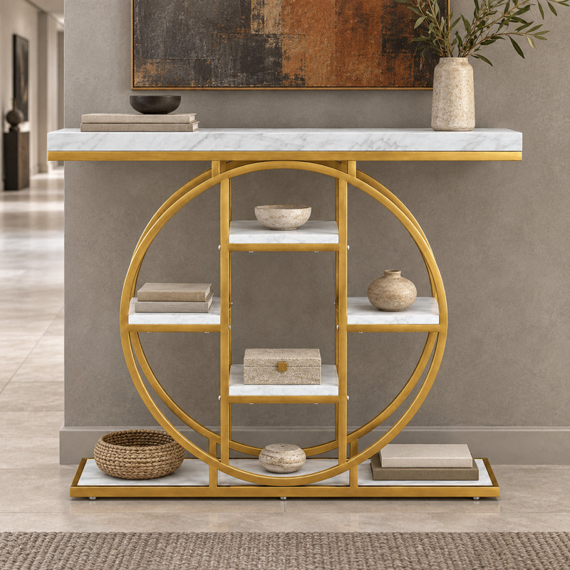 Console moderne et glamour de forme circulaire avec structure en métal et étagère ouverte, idéale pour l'entrée et le salon.