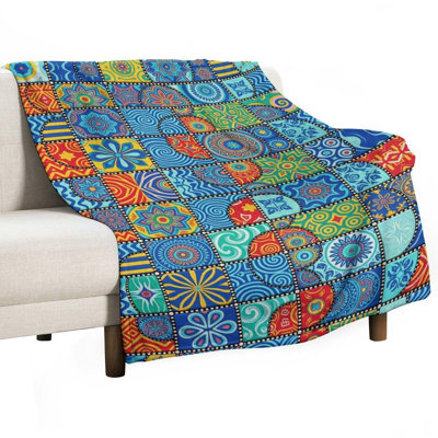 Jeté en flanelle de luxe à motif géométrique coloré, couverture douce et chaude pour le canapé-lit du salon