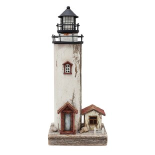 Nautical themed decor in room! - Picture of Lighthouse and Beach