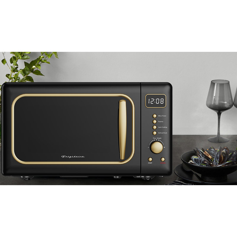 Frigidaire 0,7 pi³ Pi. Four à micro-ondes de 700 watts rétro, micro-ondes de comptoir avec 6 options de cuisson automatique, 10 niveaux de puissance