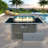 Propane Gas Fire Pit Table With Glass Wind Guard And An Open Basket-wave Patterned Wicker-1240792518