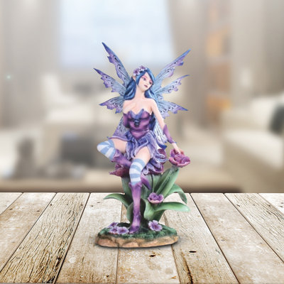 10"H Purple Fairy Sitting on Flower Figurine