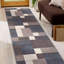 Tapis bleu touffeté à motif géométrique Allyne-1288546282