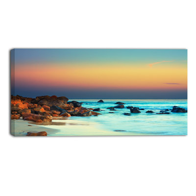 «Sunset Over Sky Seascape» par Designart - reproduction de photo sur toile