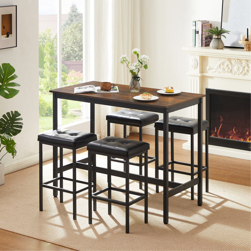 Ensemble de table de pub de style industriel avec chaises en cuir synthétique Geoffory pour manger et recevoir